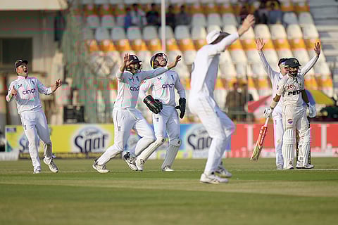 Pakistan vs England: England's Jamie Smith, center, and teammates celebrate after the dismissal of Pakistan's Saud Shakeel