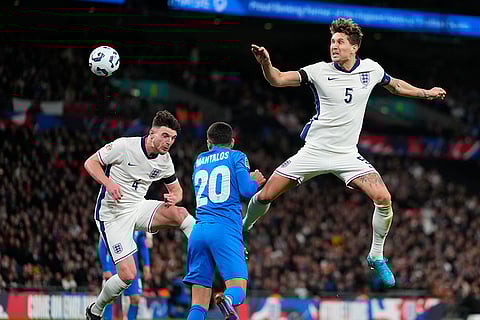 Nations League Soccer: England's John Stones, right, and Declan Rice, left, challenge for the ball with Greece's Petros Mantalos