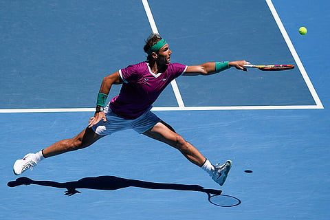 Rafael Nadal of Spain plays a backhand return to Yannick Hanfmann at the Australian Open in 2022