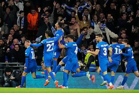 Nations League Soccer: Greece's Vangelis Pavlidis, top, celebrates with teammates after scoring his side's second goal