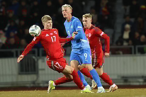 Nations League Soccer: Jordan James of Wales, left, challenges Iceland's Orri Óskarsson