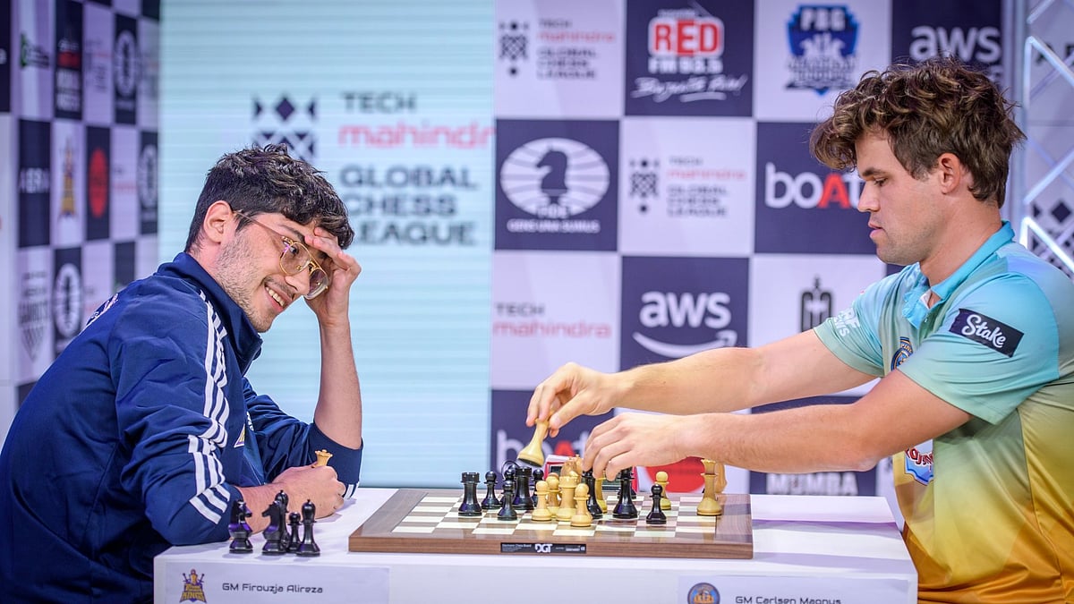 Photo: X | ChessBase India : Alireza Firouzja (L) with Magnus Carlsen in the Global Chess League.