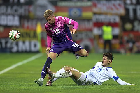 Nations League Soccer: Bosnia's Armin Gigovic tackles Germany's Maximilian Mittelstadt