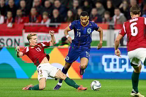 Nations League Soccer: Hungary's Andras Schafer, left, tries to tackle Cody Gakpo of the Netherlands