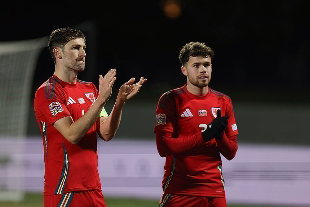 | Photo: AP/Arni Torfason : Nations League Soccer: Ben Davies of Wales, left, and Neco Williams applaud the crowd