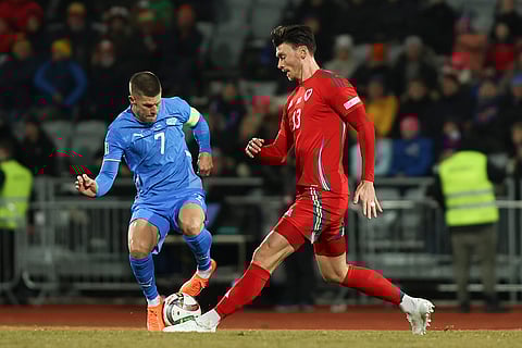 Nations League Soccer: Kieffer Moore of Wales, right, challenges Iceland's Jóhann Guðmundsson
