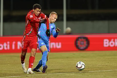 Nations League Soccer: Brennan Johnson of Wales, left, is challenged