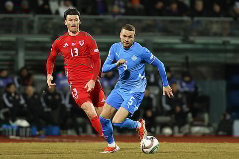 Nations League Soccer: Kieffer Moore of Wales chases Iceland's Sverrir Ingason