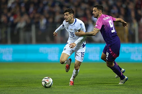 Nations League Soccer: Bosnia's Armin Gigovic, left, and Germany Kleindienst fight for the ball