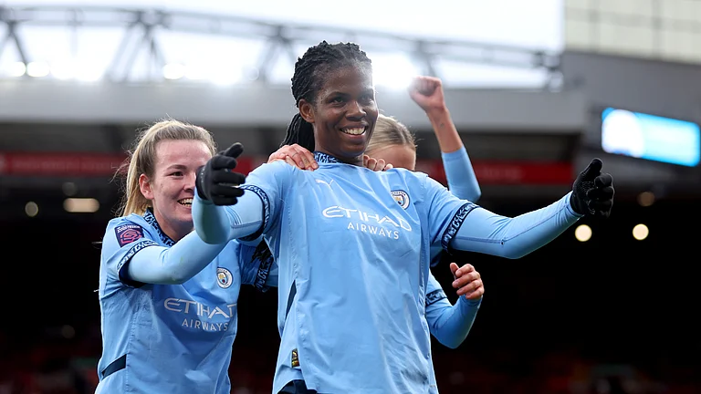 Khadija Shaw celebrates at Anfield on Sunday with her Manchester City team-mates - null