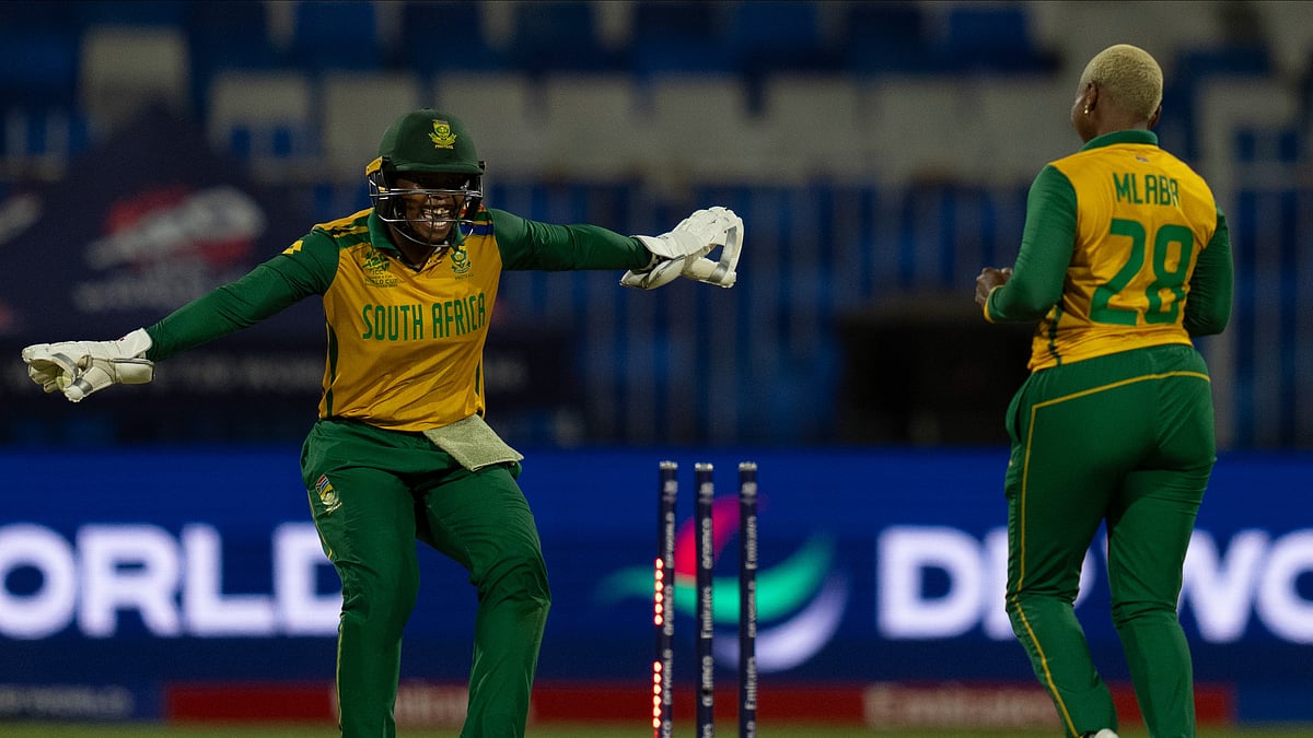 Photo: AP Photo/Altaf Qadri : South Africa's wicketkeeper Sinalo Jafta, left, celebrates after stumping out England's Danni Wyatt during the ICC Women's T20 World Cup 2024 match between England and South Africa at Sharjah Stadium.