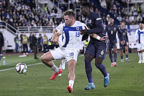 Nations League Soccer: Finland's Benjamin K'llman, left, challenge for the ball with England's Marc Guehi