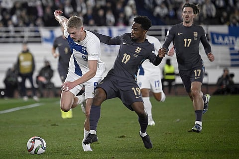 Nations League Soccer: Finland's Fredrik Jensen, left, challenges for the ball with England's Angel Gomes