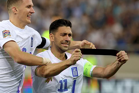 Nations League Soccer: Greece's Tasos Bakasetas celebrates with Christos Tzolis, left, after scoring the opening goal