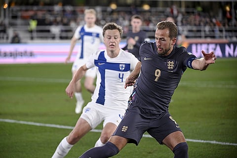 Nations League Soccer: Finland's Robert Ivanov, left, challenges for the ball with England's Harry Kane