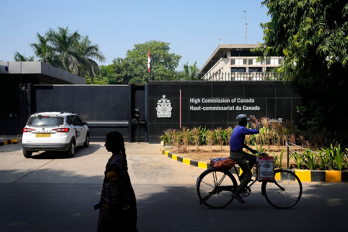 A cyclist pedals past the Canadian High Commission in New Delhi, India, Tuesday, Oct 15, 2024.