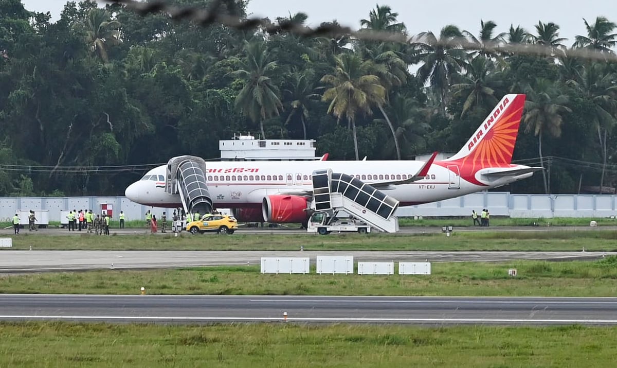 PTI : In this Aug. 22, 2024 file photo, security personnel conduct inspection of an Air India aircraft, in Thiruvananthapuram.