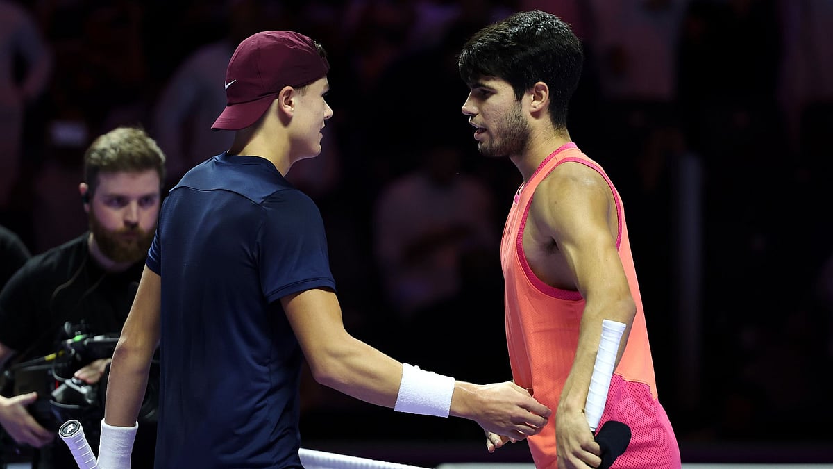 Alcaraz (right) is congratulated by Rune following their battle - null