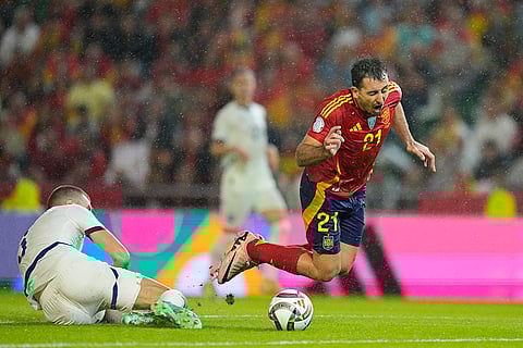 Nations League Soccer: Spain's Mikel Oyarzabal, right is fouled by Serbia's Strahinja Pavlovic