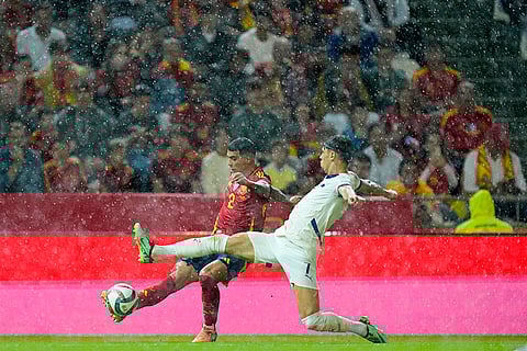 Nations League Soccer: Spain's Pedro Porro, left, is tackled by Serbia's Dusan Vlahovic