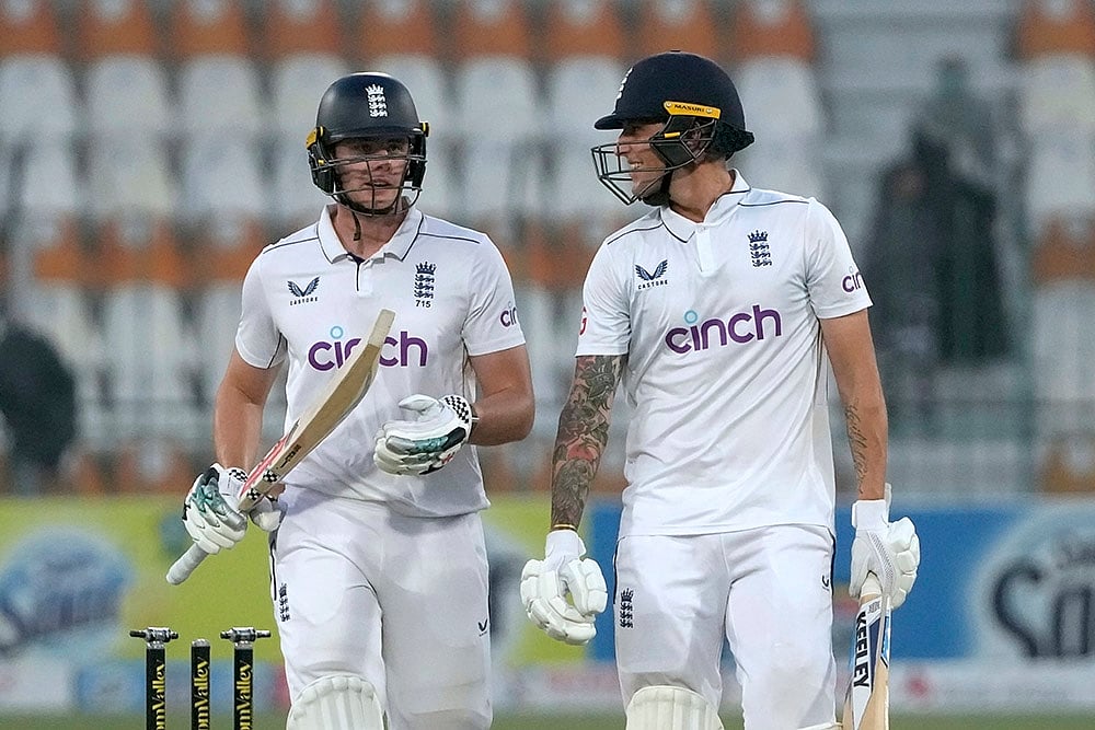 | Photo: AP/K.M. Chaudary : PAK Vs ENG 2nd Test: England's Jamie Smith, left, and Brydon Carse walk off the field on the end of the play