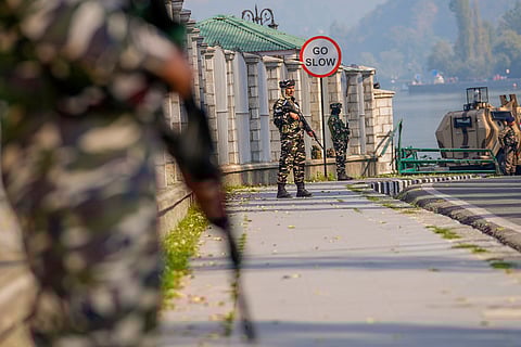 New J&K govt: Paramilitary soldiers stand guard outside the venue of swearing in ceremony