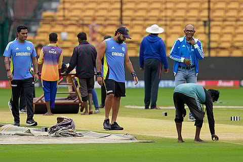 IND Vs NZ 1st Test: Rohit Sharma, center, checks the pitch