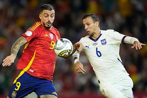 Nations League Soccer: Spain's Joselu, left and Serbia's Nemanja Maksimovic challenge for the ball
