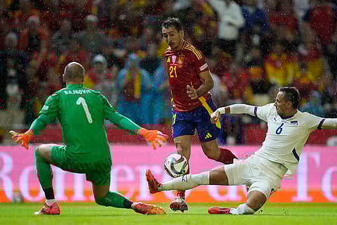 Nations League Soccer: Spain's Mikel Oyarzabal, centre, is tackled by Serbia's Nemanja Maksimovic