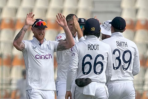 PAK Vs ENG 2nd Test: England's Ben Stokes, left, and teammates celebrate the dismissal of Pakistan's Mohammad Rizwan