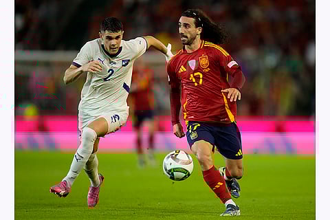 Nations League Soccer: Spain's Marc Cucurella, right, is chased by Serbia's Kosta Nedeljkovic