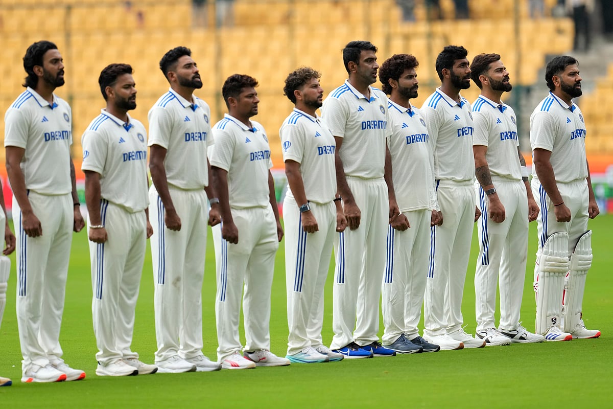  (AP Photo/Aijaz Rahi) : Team India players stand for their national anthem before the start of the day two of the first cricket test match between India and New Zealand at the M.Chinnaswamy Stadium, in Bengaluru, India, Thursday, Oct. 17, 2024.