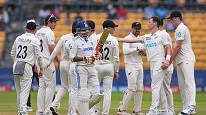 PTI Photo/Shailendra Bhojak : New Zealand's Matt Henry celebrates with teammates after taking the wicket of India's Ravindra Jadeja during the second day of the first Test cricket match between India and New Zealand, at M Chinnaswamy Stadium, in Bengaluru.