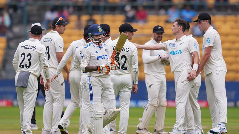 New Zealands Matt Henry celebrates with teammates. PTI Photo