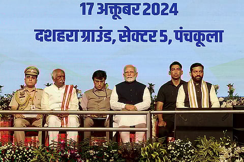 Haryana CM oath ceremony: PM Narendra Modi with Haryana Governor Bandaru Dattatreya and CM-designate Nayab Saini