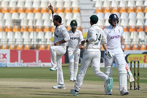 PAK Vs ENG 2nd Test: Pakistan's Noman Ali, left, celebrates after taking the wicket of England's Jamie Smith