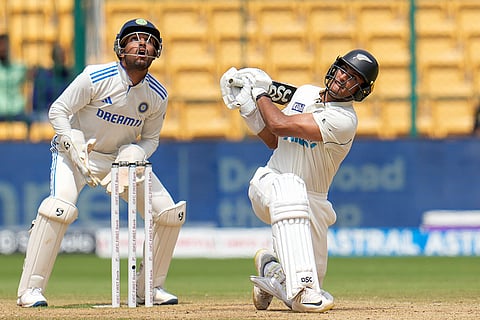IND Vs NZ 1st Test: New Zealand's Rachin Ravindra, right, hits a shot