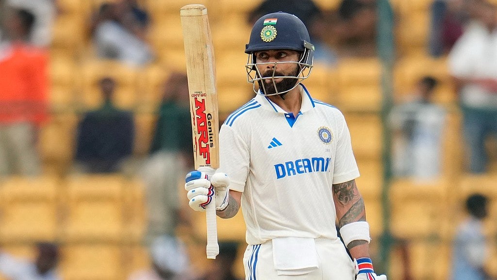 Virat Kohli acknowledges the applause after getting to his 31st Test half-century during the first India vs New Zealand Test in Bengaluru.  - AP/Aijaz Rahi