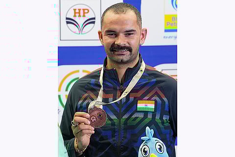 ISSF World Cup: Akhil Sheoran of India poses with his bronze medal