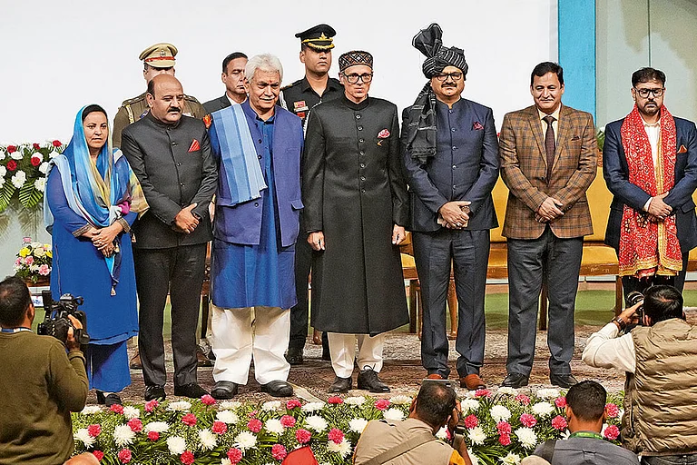 Ready for Action?: Omar Abdullah (fourth from left) at the swearing-in ceremony of the new J&K government in Srinagar on October 16, 2024 - Photo: PTI
