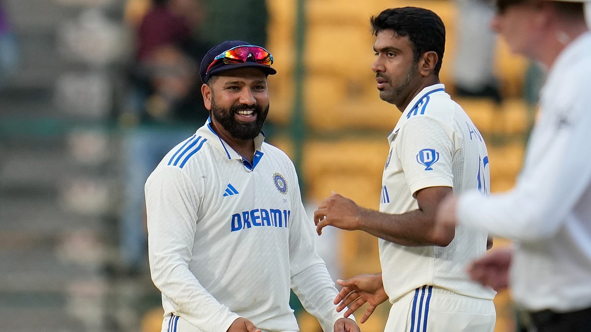 Indias Ravichandran Ashwin, right, celebrates with captain Rohit Sharma. AP Photo