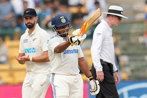 IND Vs NZ 1st Test: India's Sarfaraz Khan, center, celebrates after scoring fifty runs