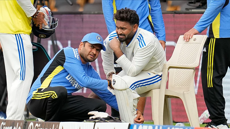 Indias Rishabh Pant reacts in pain as he is attended by a member of support staff. AP Photo
