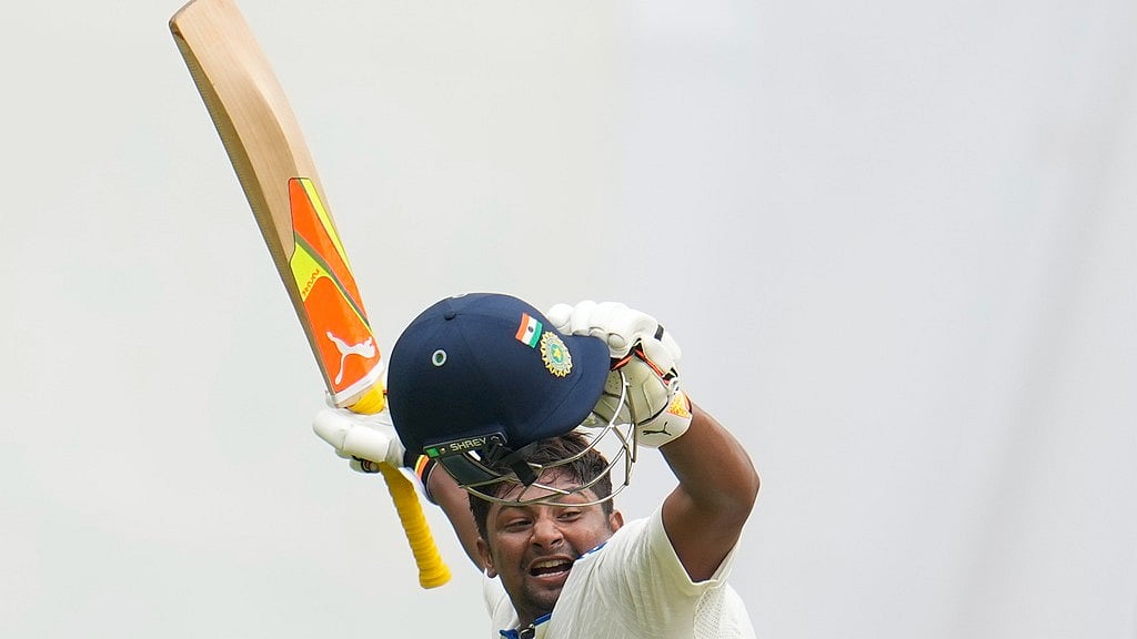 Sarfaraz Khan celebrates after scoring his maiden international century during the fourth day of the first India vs New Zealand Test in Bengaluru. - AP/Aijaz Rahi