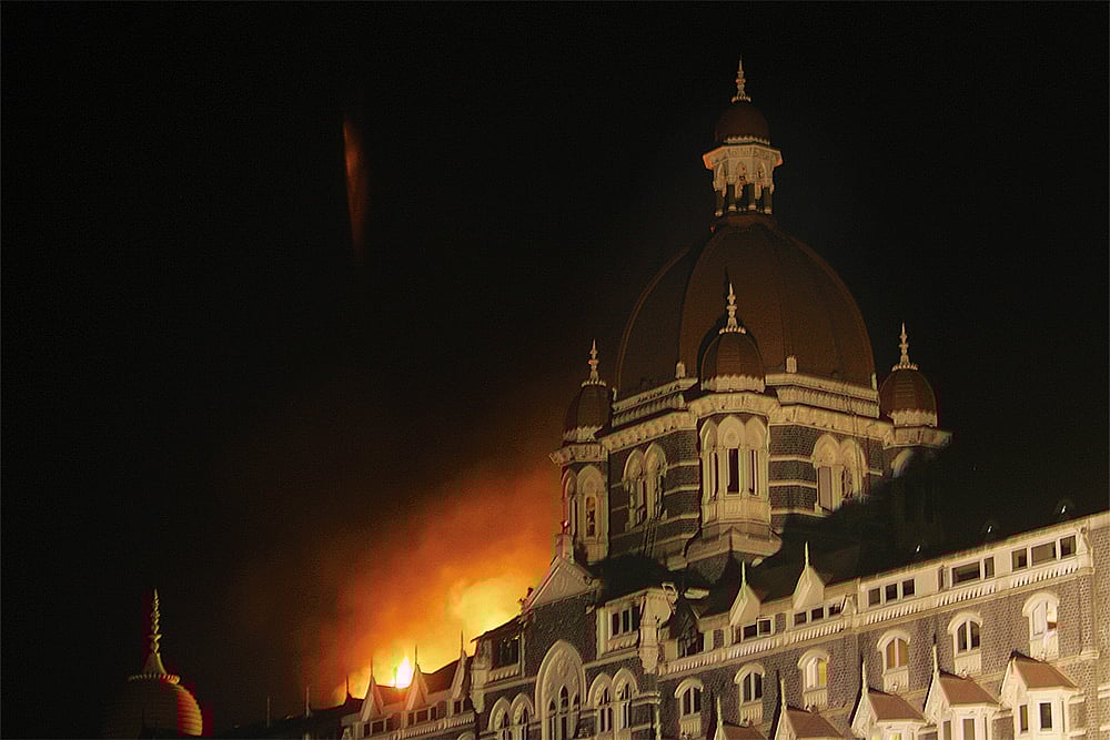 Photo: Getty Images : Fire at the Taj Hotel during the 26/11 attack