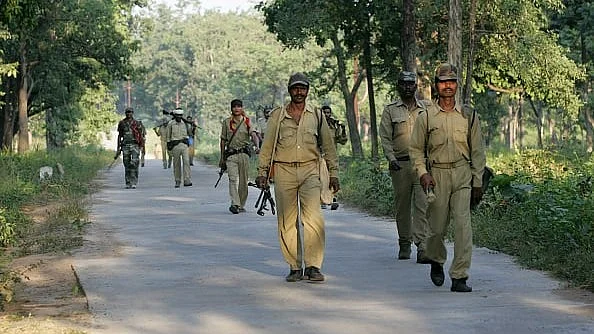 Police officers patrolling Naxal militancy affected forests at Bijapur, near Dantewada