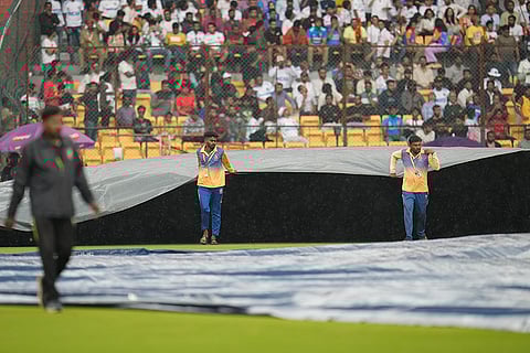 IND Vs NZ 1st Test: Groundsmen pull on the covers after rain stopped play on the day four
