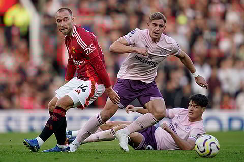 EPL 2024-25: Man United's Christian Eriksen, left, duels for the ball with Brentford's Yehor Yarmolyuk, center, and Christian Norgaard