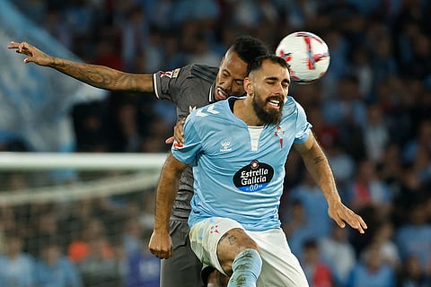 La liga 2024-25: Real Madrid's Eder Militao, left and Celta's Borja Iglesias jump for the ball