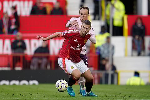 EPL 2024-25: Manchester United's Matthijs de Ligt, front, duels for the ball with Brentford's Mikkel Damsgaard